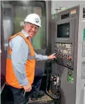  ?? A1SLT ?? Steve Davies MBE, chairman of The A1 Steam Locomotive Trust, presses the button to start machining the first component at Howco Group plc.