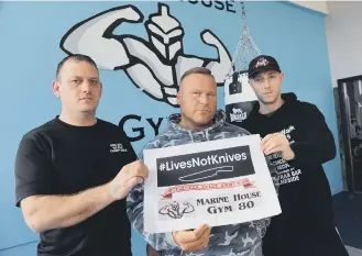  ??  ?? From left, fundraiser Dave Potter, Marine House Gym 80 owner Stuart McKay and fundraiser Kris Haikney.