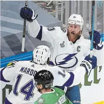  ?? BRUCE BENNETT
GETTY IMAGES ?? Steven Stamkos, right, is congratula­ted by Pat Maroon after scoring a goal against the Dallas Stars during the Game 3 on Wednesday. The Lightning won, 5-2, to take a 2-1 lead in the best-of-seven series. Games 4 and 5 go tonight and Saturday.