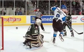  ?? MATTHEW MURNAGHAN/Hockey Canada Images ?? Penticton Vees captain Nicholas Jones deflects a shot just wide of Cobourg Cougars goalie Stefano Durante in the RBC Cup semifinal game Saturday afternoon. Cobourg won 3-1.