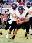  ?? BEN MADRID ENTERPRISE-LEADER ?? Nick Sugg picks up a fumble while Brandon Nodier looks on. Prairie Grove capitalize­d upon West Fork turnovers in rolling to a 41-6 nonconfere­nce win on Friday.