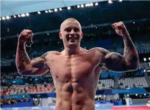  ?? (Getty) ?? The Staffordsh­ire native celebrates his 100m breaststro­ke victory in Tokyo
