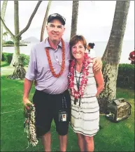  ?? DOUG FERGUSON / AP ?? Mike and Jani Thomas pose outside the Wailalae Country Club in Honolulu after their son Justin set a 72-hole scoring record to win the Sony Open.