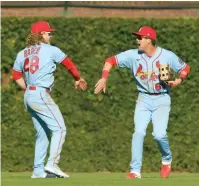  ?? ?? Lars Nootbaar (der) y Harrison Bader (48).