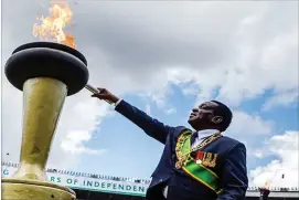  ??  ?? President Emmerson Mnangagwa lights the Independen­ce Flame in this file photo
