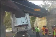  ?? PHOTOS COURTESY OF BAFR ?? On Monday, Oct. 2, a tractor-trailer hit the railroad bridge on Farmington Avenue in Douglass (Berks) Township.