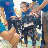  ??  ?? Maggu’s nephew Praneit, nine, trying out the exoskeleto­n in Delhi. COURTESY TREXO ROBOTICS