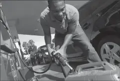  ?? DON BARTLETTI/LOS ANGELES TIMES FILE PHOTOGRAPH ?? At a San Marcos, California gas station, Ray Campbell fills a portable generator on Sept. 9 , 2011. California gas prices average $3 a gallon for the first time since September 2015.