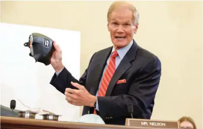  ??  ?? WASHINGTON: In this Thursday, Nov. 20, 2014, file photo, Senate Commerce Committee member Sen. Bill Nelson, D-Fla., displays the parts and function of a defective airbag made by Takata of Japan that has been linked to multiple deaths and injuries in...