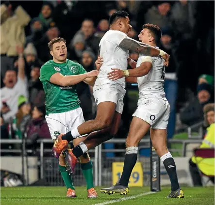  ?? GETTY IMAGES ?? England’s new-look centre pairing of Henry Slade, right, and Manu Tuilagi celebrate Slade’s try against Ireland last Sunday.