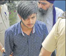  ?? GURMINDER SINGH/HT ?? One of the accused coming out of the NIA court in Mohali on Wednesday.