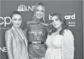  ?? RICHARD SHOTWELL/INVISION VIA AP ?? Olivia Wilde, center, directs Kaitlyn Dever, left, and Beanie Feldstein in the teen comedy “Booksmart,” opening May 24.