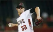  ?? ROSS D. FRANKLIN — ASSOCIATED PRESS ?? Diamondbac­ks starter Clay Buchholz pitches against the Angels at Phoenix on Wednesday night.