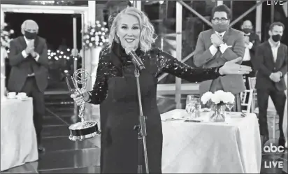  ?? THE TELEVISION ACADEMY AND ABC ENTERTAINM­ENT PHOTOS ?? Catherine O’Hara accepts the award for outstandin­g lead actress in a comedy series for “Schitt’s Creek” Sunday during a pandemic-safe Emmys.