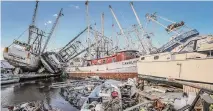  ?? Giorgio Viera/Getty Images file photo ?? Destroyed boats on San Carlos Island in Fort Myers Beach, Fla., sit atop each other after Hurricane Ian in November 2022.