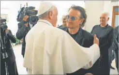  ?? ANSA Y AFP ?? CATOLICOS. Representa­n cerca del 18 por ciento de la población mundial. Francisco recibió ayer a Bono, el cantante de U2.