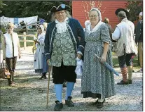  ??  ?? Benjamin Franklin and his bride, Deborah (well, their doppelgang­ers) stroll the grounds and pose for pictures at Colonial Times in North Augusta. The park offers glimpses into the lives of South Carolina’s early settlers.