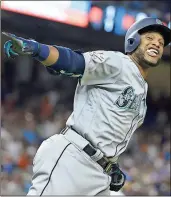  ?? / The Associated Press ?? Lynne Sladky
The American League’s Robinson Cano rounds the bases after hitting a home run in the 10th inning during the All-Star Game on Tuesday night in Miami.