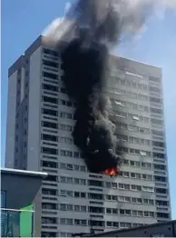  ??  ?? Emergency: The tower block blaze yesterday