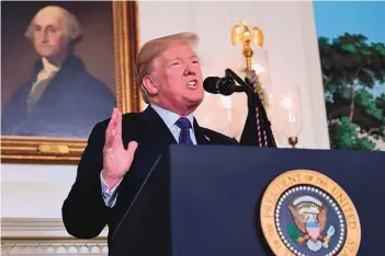  ?? SUSAN WALSH/ASSOCIATED PRESS ?? President Donald Trump speaks at the White House on Friday about the United States’ military response to Syria’s chemical weapons attack against civilians on April 7.