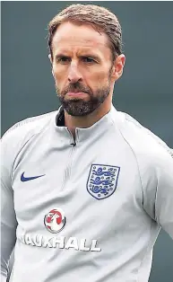  ??  ?? England head coach Gareth Southgate watches his players take part in a training session at the 2018 World Cup.