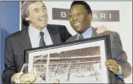  ?? PICTURE: PA ?? LEAP OF FAITH: Gordon Banks and Pele hold a photograph of the England goalkeeper’s famous save from the Brazil striker.