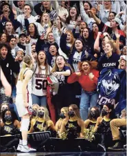  ?? Stephen Slade / Contribute­d via UConn Athletics ?? This photo of Paige Bueckers pumping up the crowd in Storrs went viral on social media this week.