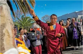  ?? ASSOCIATED PRESS PHOTOS/GODOFREDO A. VASQUEZ Below: ?? Above: Khenpo Paljor, a Tibetan lama from Des Moines, Iowa, leads a prayer March 16 at the Birthplace of Antioch marker in Antioch, Calif. Sasanna Yee prays in front of an altar March 16 during a pilgrimage in Antioch.