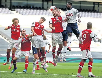  ?? Picture: PA. ?? Toby Alderweire­ld heads in Tottenham’s late winner in the victory over north London rivals Arsenal.