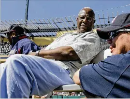  ?? DAVID J. PHILLIP/ASSOCIATED PRESS ?? Then-braves third baseman Chipper Jones (right) talks with Baseball Hall of Famer Hank Aaron during a spring training workout Feb. 18, 2009, in Lake Buena Vista, Fla. “He played for the galactic All-stars,” Jones said Friday after Aaron’s death. “We’re just mere earthlings, and he’s on a different level.”