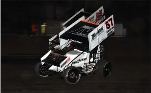  ?? RICH KEPNER - FOR MEDIANEWS GROUP ?? Kyle Larson (57) passes Freddie Rahmer for the Hodnett Cup win Tuesday night at Grandview Speedway.