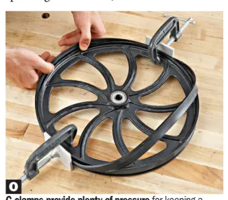  ??  ?? O
C-clamps provide plenty of pressure for keeping a bandsaw tire in place while stretching it onto the wheel.