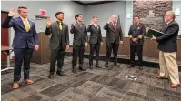  ?? ?? West Chester Twp. hired five more new firefighte­rs in a quest to transition to a full-time career department. Fiscal Officer Bruce Jones swore the men in on Tuesday. The new hires are (from left) Charles Rielage, Levi Bailey, Cody Swall, Jack Rebholz and Sam Thompson.