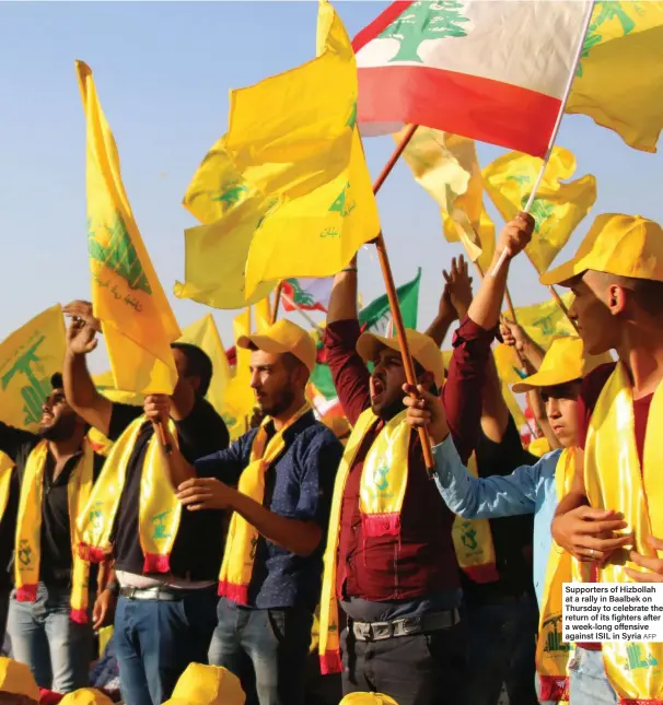  ?? AFP ?? Supporters of Hizbollah at a rally in Baalbek on Thursday to celebrate the return of its fighters after a week-long offensive against ISIL in Syria