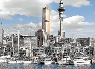  ??  ?? An artist’s impression­s of ICD Property’s new high-rise, which will stand near Auckland’s Sky Tower. Its unique windows, below, have earned it the nickname ‘‘cheese grater’’.