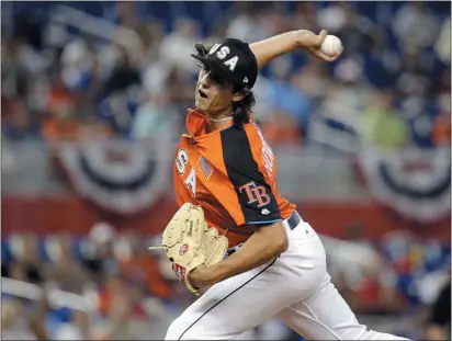  ?? LYNNE SLADKY — THE ASSOCIATED PRESS ?? Tampa Bay Rays and the U.S. Team pitcher Brent Honeywell throws during the first inning of the 2017AllSta­r Futures game against the World Team. Honeywell is expected to make his big league debut this season and features the little-used screwball.