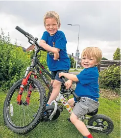  ?? Steve Brown. Picture: ?? Fundraisin­g brothers Daniel, left, and Oliver, 2.