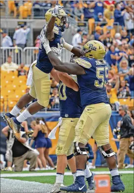  ?? JUSTIN BERL / GETTY IMAGES ?? A.J. Davis (hoisted by teammates after scoring against Youngstown State) is part of a Pittsburgh offense that uses a variety of weapons.