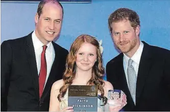  ?? PAUL GROVER THE ASSOCIATED PRESS ?? Thomas A. Stewart Secondary School student Faith Dickinson, seen last year with Prince Harry, right, and Prince William, left, at St. James Palace in London, England, has been invited to Prince Harry’s wedding.