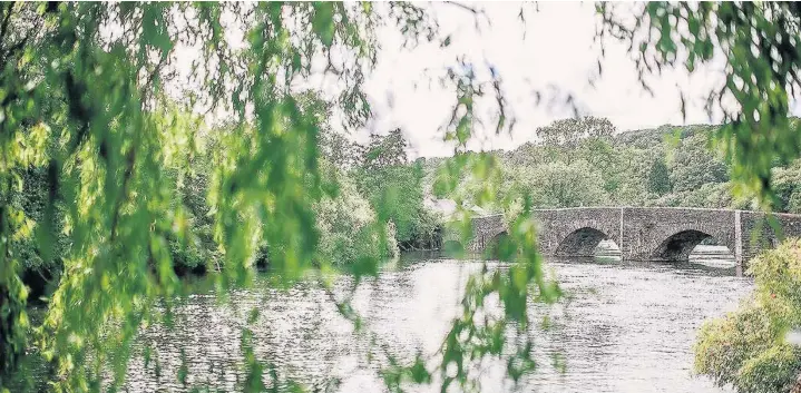  ??  ?? A view of Newby Bridge’s titular bridge over the River Leven