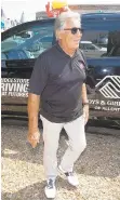  ??  ?? Racing legend and Bushkill Township resident Mario Andretti smiles after exiting the new Allentown Boys & Girls Club van Thursday.