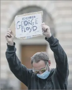  ??  ?? SUPPORT A protester in Edinburgh Pic: PA
