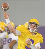  ?? GERALD HERBERT/ASSOCIATED PRESS ?? LSU quarterbac­k Joe Burrow saw his path to playing time at Ohio State looking bleak and decided to transfer. Burrow won a starting job — and sent two more quarterbac­ks into the transfer market.