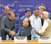  ?? PTI ?? Finance minister Arun Jaitley greets Himachal Pradesh chief minister Jai Ram Thakur during a preBudget meeting in New Delhi on Thursday. Tamil Nadu deputy CM O Panneersel­vam and MoS finance Shiv Pratap Shukla are also seen shaking hands