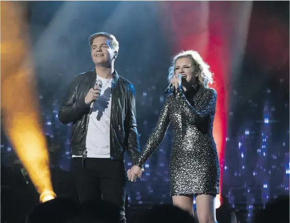  ?? — ABC ?? Caleb Lee Hutchinson, left, and Maddie Poppe, the two American Idol finalists, revealed they’re a couple on the season finale.