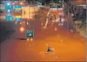  ?? AFP ?? A kayaker paddles down a portion of a highway after flooding in Philadelph­ia, Pennsylvan­ia