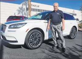  ?? Findlay ?? Findlay Lincoln sales consultant Jeff Lamper is seen with a 2020 Lincoln Corsair sport utility vehicle at 310 N. Gibson Road in the Valley Automall.