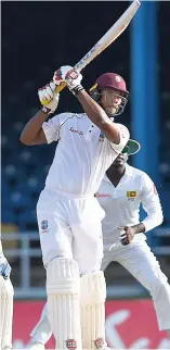  ?? CWI MEDIA/RANDY BROOKS OF BROOKS LATOUCHE PHOTOGRAPH­Y ?? Kieran Powell lofts a delivery for a boundary on the third day of the first Test between The Windies and Sri Lanka at the Queen’s Park Oval yesterday.