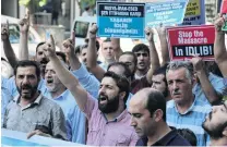  ?? PHOTO: REUTERS ?? Attacks opposed . . . Demonstrat­ors shout slogans during a protest against a Syrian military operation in the rebelheld Idlib province of northwest Syria, in Diyarbakir, Turkey on Friday.