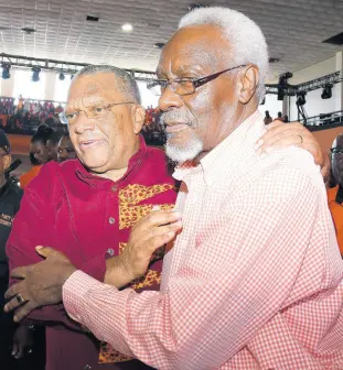  ?? FILE ?? Dr Peter Phillips (left) is greeted by P.J. Patterson, former prime minister, on his arrival at the People’s National Party’s 81st Annual Conference at the National Arena on September 23.